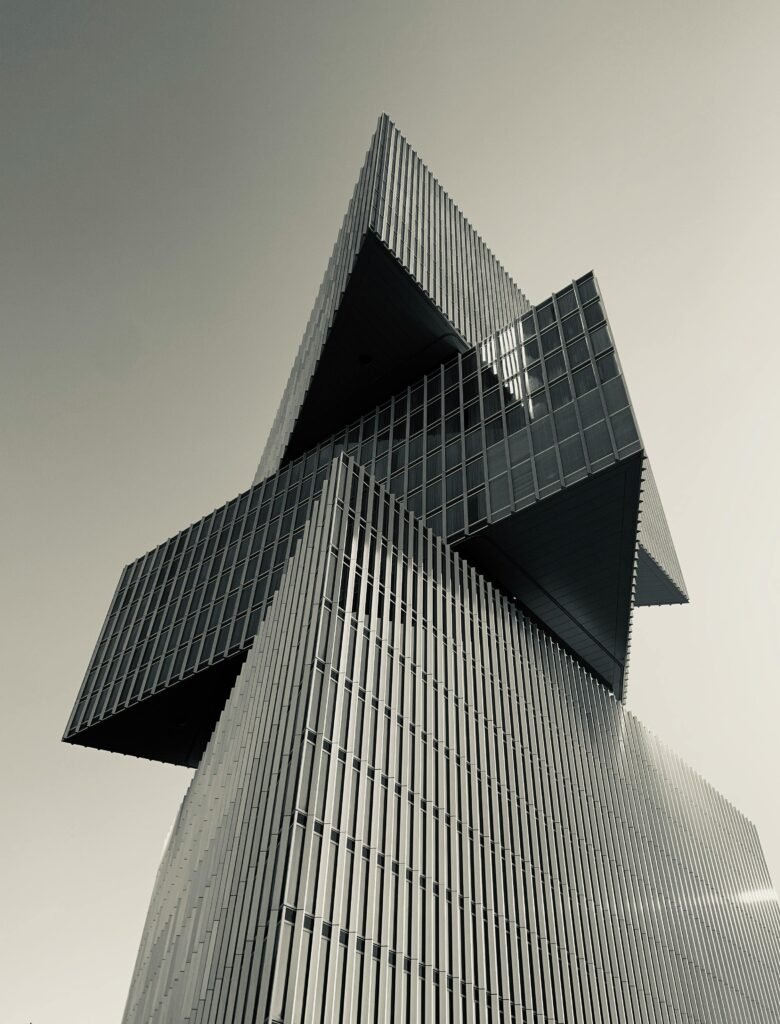 Stunning geometric architecture captured with a low-angle view in Amsterdam, Netherlands.